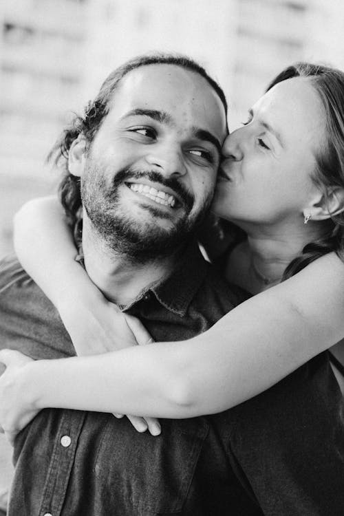 Man and Woman Smiling in Grayscale Photography