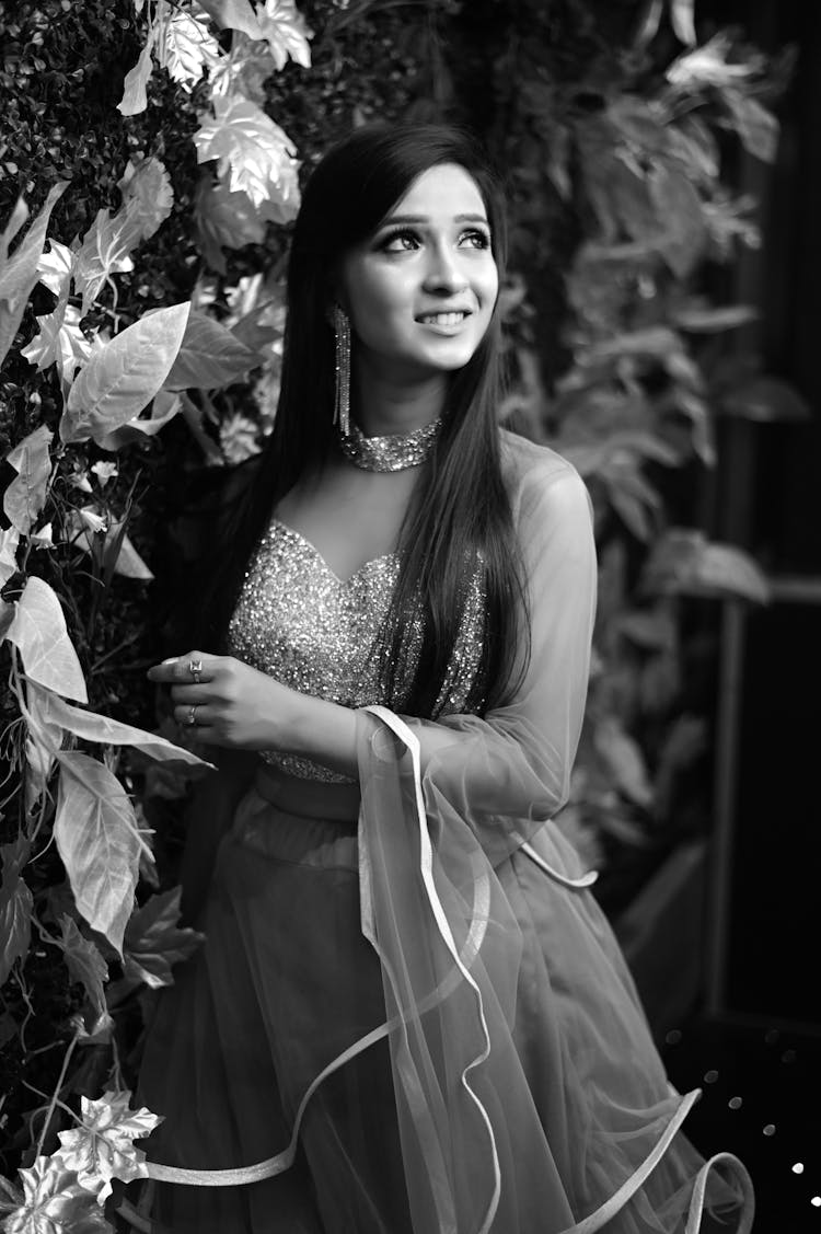 Grayscale Photo Of A Woman In Saree