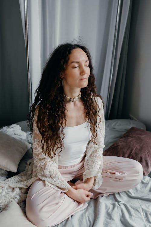 A Woman Sitting on the Bed