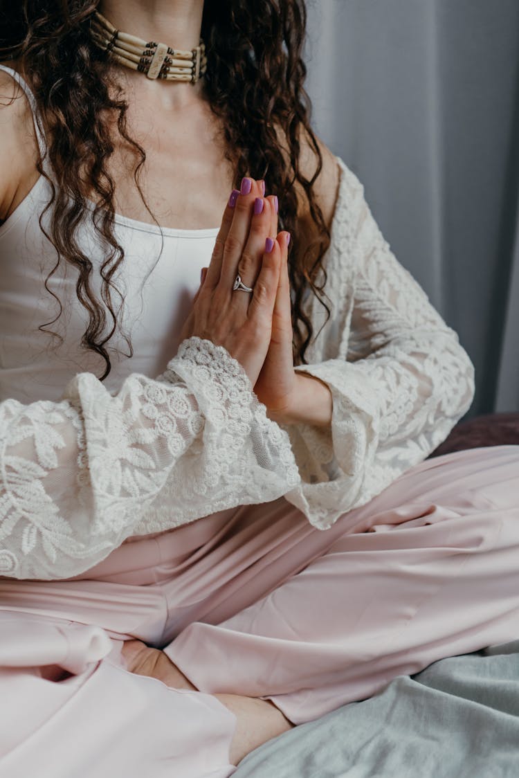 A Woman Sitting On The Bed