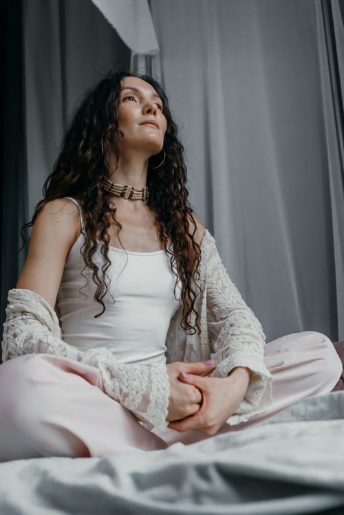 Free Young woman practicing meditation indoors, promoting mindfulness and relaxation. Stock Photo