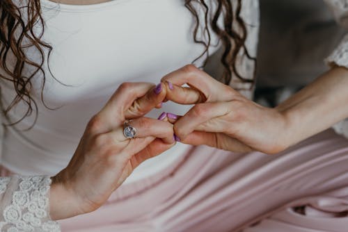 A Person Wearing Silver Ring Meditating