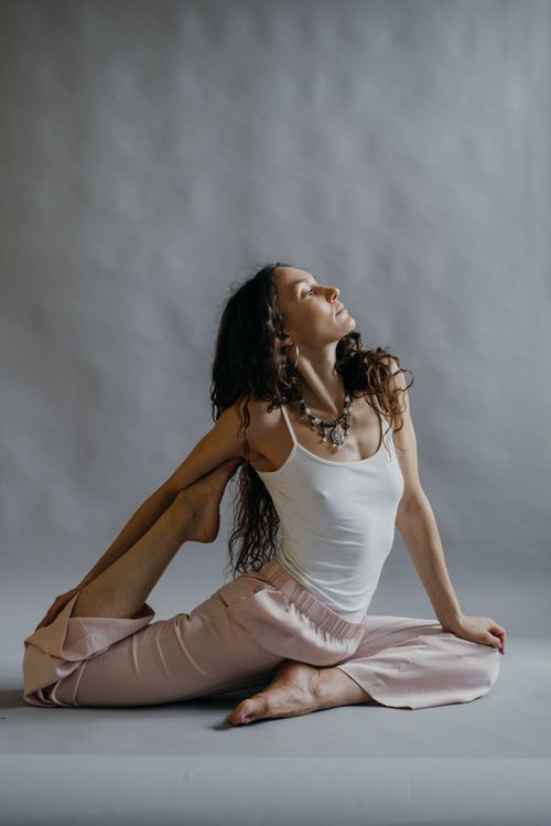 Free A woman practicing yoga in a studio, displaying flexibility and tranquility. Stock Photo