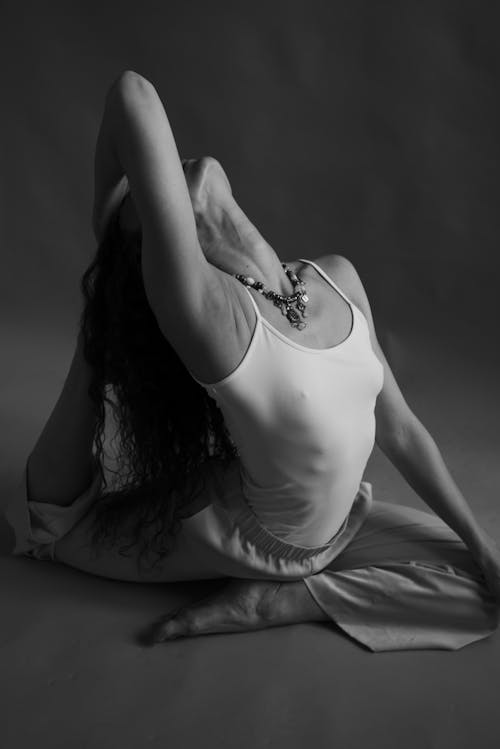 Free Grayscale Photo of a Flexible Woman Stock Photo