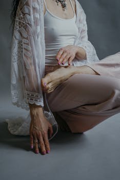 Close-up of a woman practicing yoga indoors, focusing on relaxation and mindfulness.