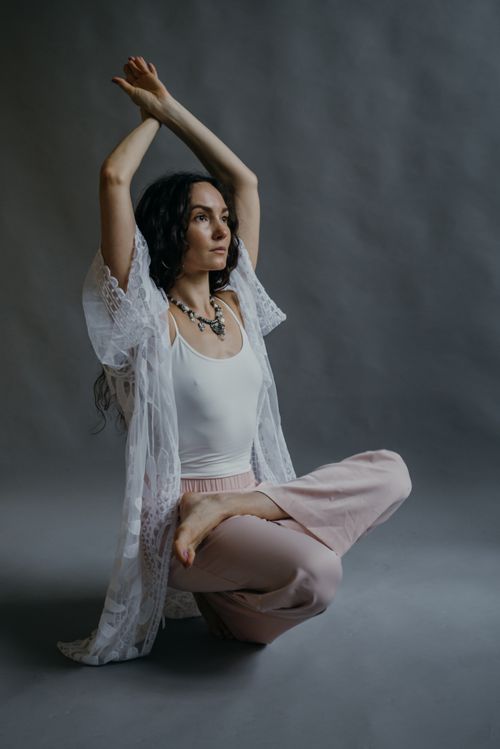 Free Adult woman practicing yoga and mindfulness indoors, embodying wellness and flexibility. Stock Photo