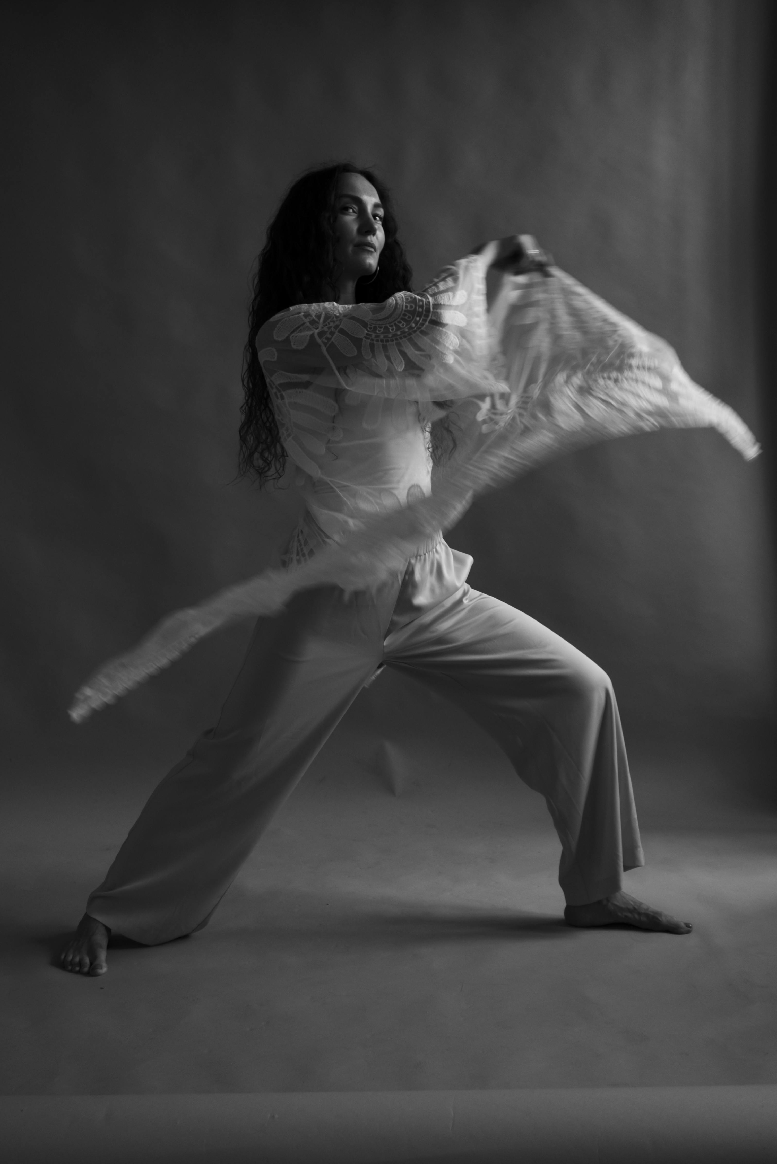 Woman in White Long Sleeve Shirt and Pants