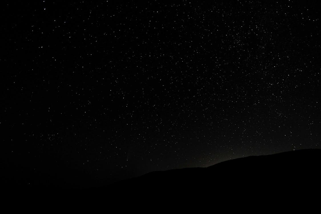 hills at night with stars