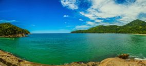 Landscape Photography of Body of Water and Green Mountain