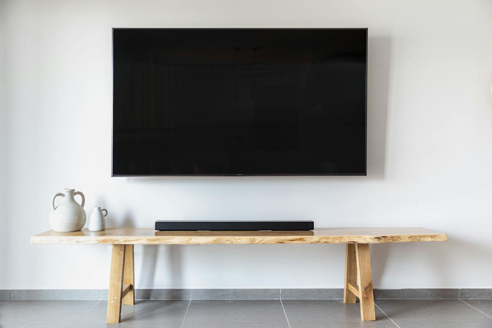 Wall-mounted TV above a modern console