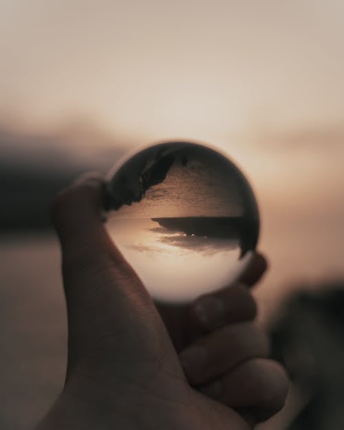 Free Close-Up Shot of a Person Holding a Lensball Stock Photo