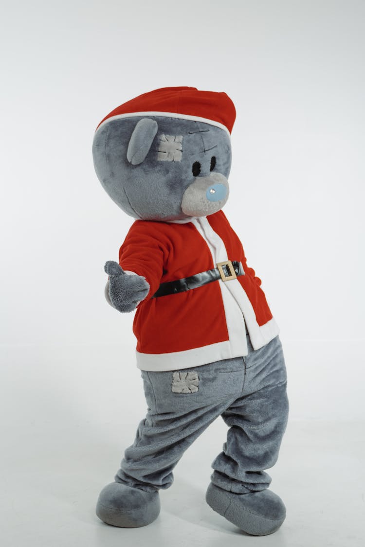 A Teddy Bear Mascot In Santa Claus Costume