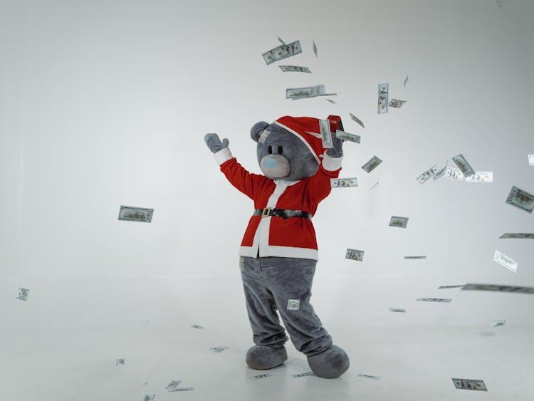 A Bear Mascot Throwing Paper Money