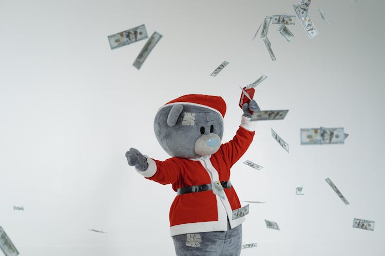 A Bear Mascot Throwing Paper Money