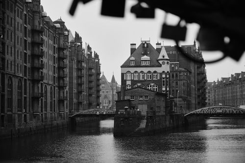 Free Grayscale image of Hamburg's iconic Speicherstadt, showcasing its canals and historic warehouses. Stock Photo