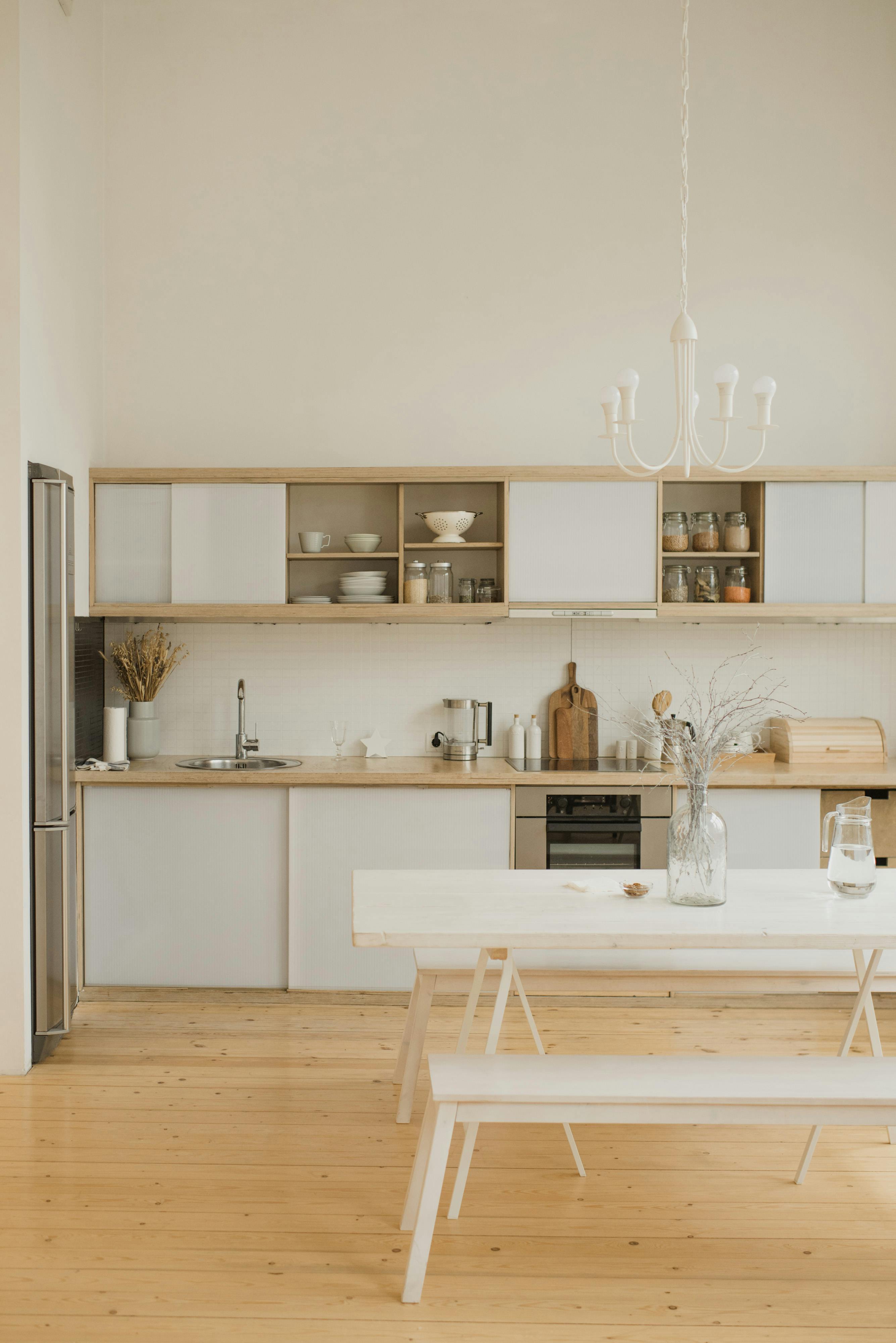 white dining table and chairs in a kitchen