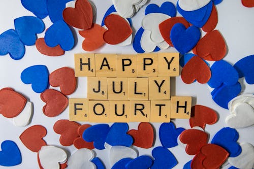 Red and Blue Hearts Near Letter Tiles