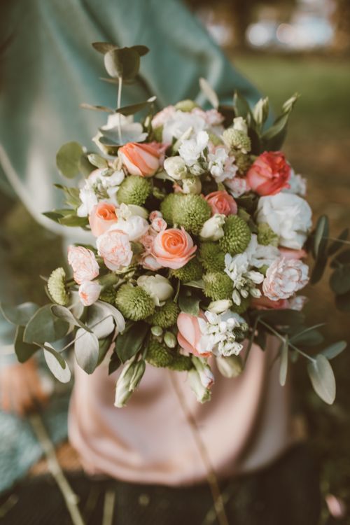 Free Close-up of a colorful flower bouquet featuring roses and green chrysanthemums. Stock Photo
