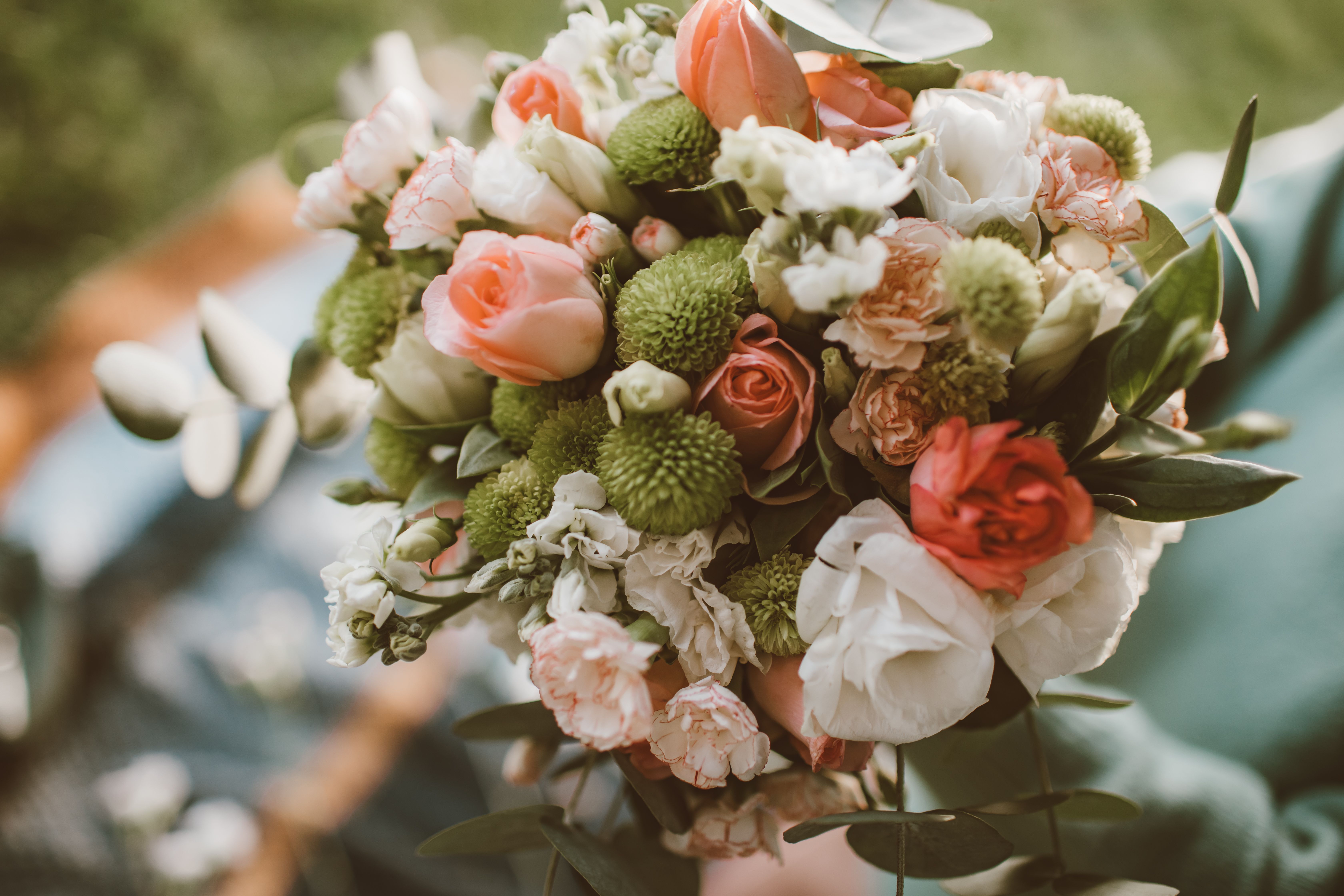 Close-up of a vibrant bouquet showcasing various spring blooms with soft light and delicate colors.
