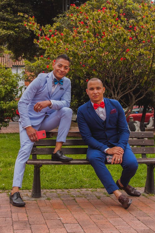 Men Wearing Suit Sitting on a Bench