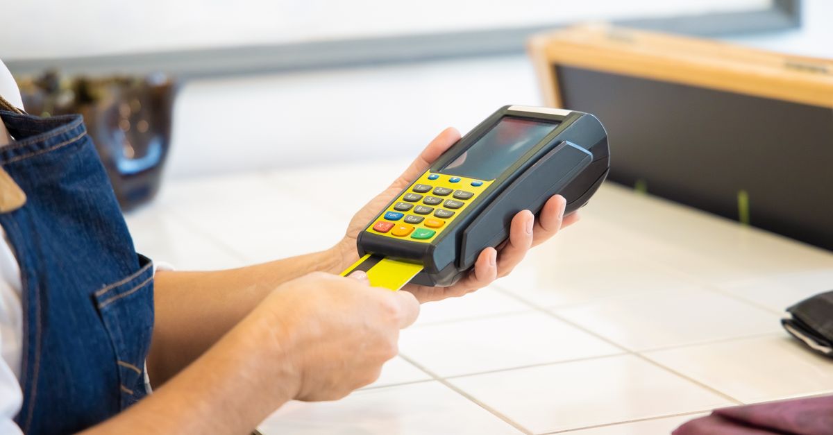 A Person Holding a POS Machine · Free Stock Photo