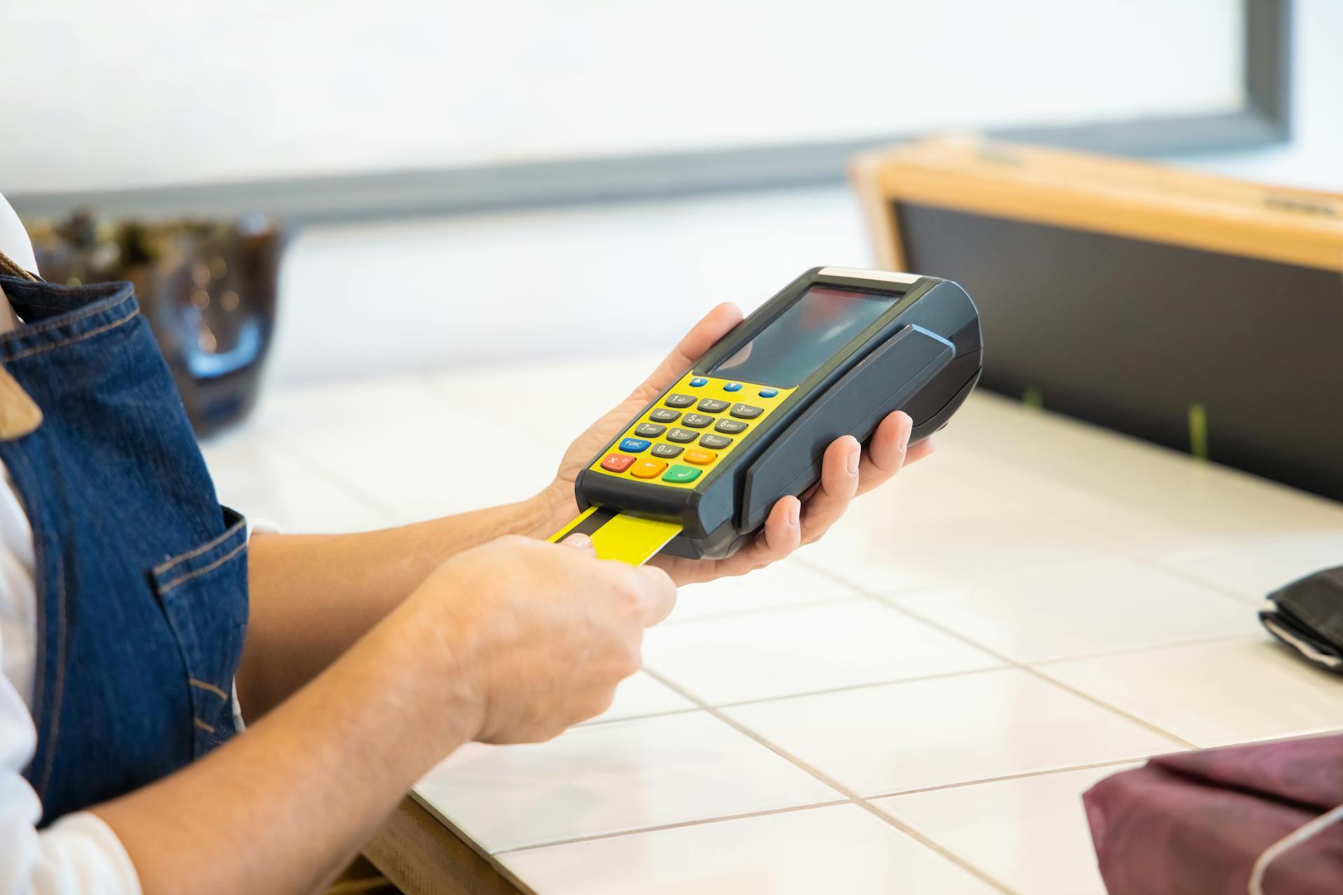 A Person Holding a POS Machine