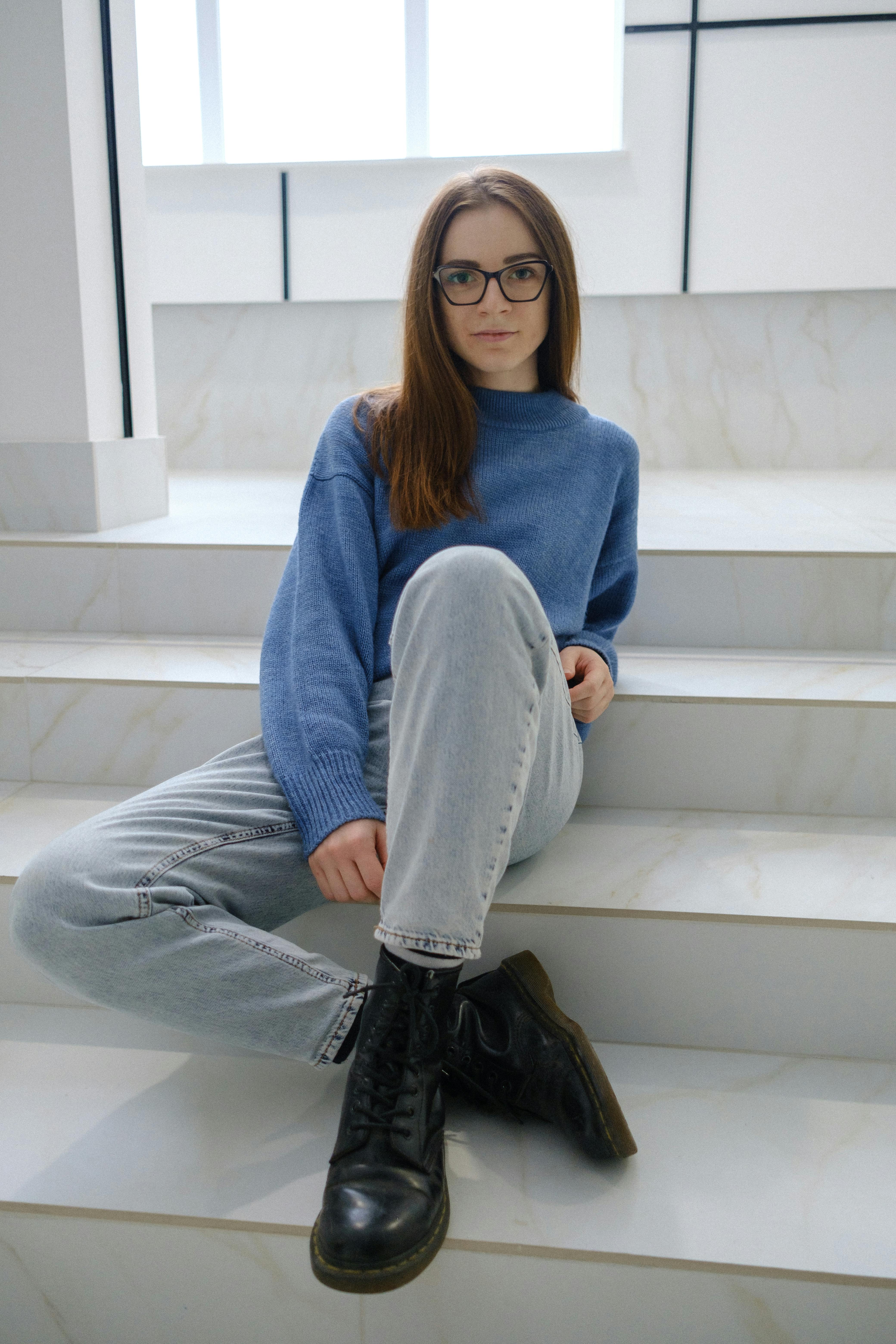 A Woman Wearing Sunglasses Sitting on Stairs · Free Stock Photo