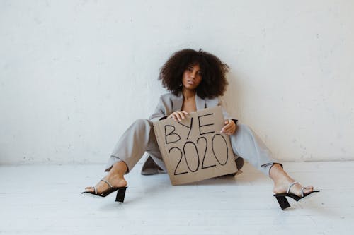 A Woman Holding a Sign About Burnout