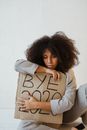 A Woman Holding a Sign About Burnout
