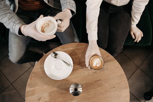 People Holding Hot Drinks