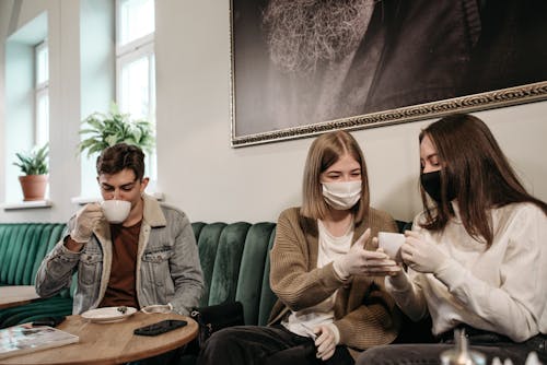 Free People Wearing Face Masks Inside the Cafe Stock Photo