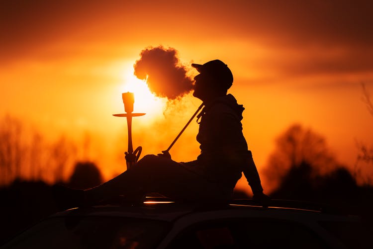 Silhouette Of A Person Smoking