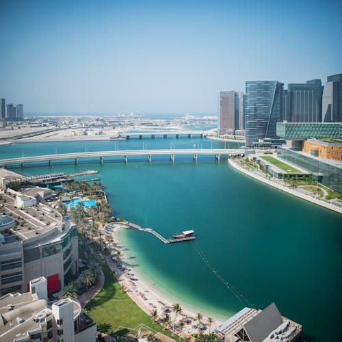 Picturesque view of city near water in daylight