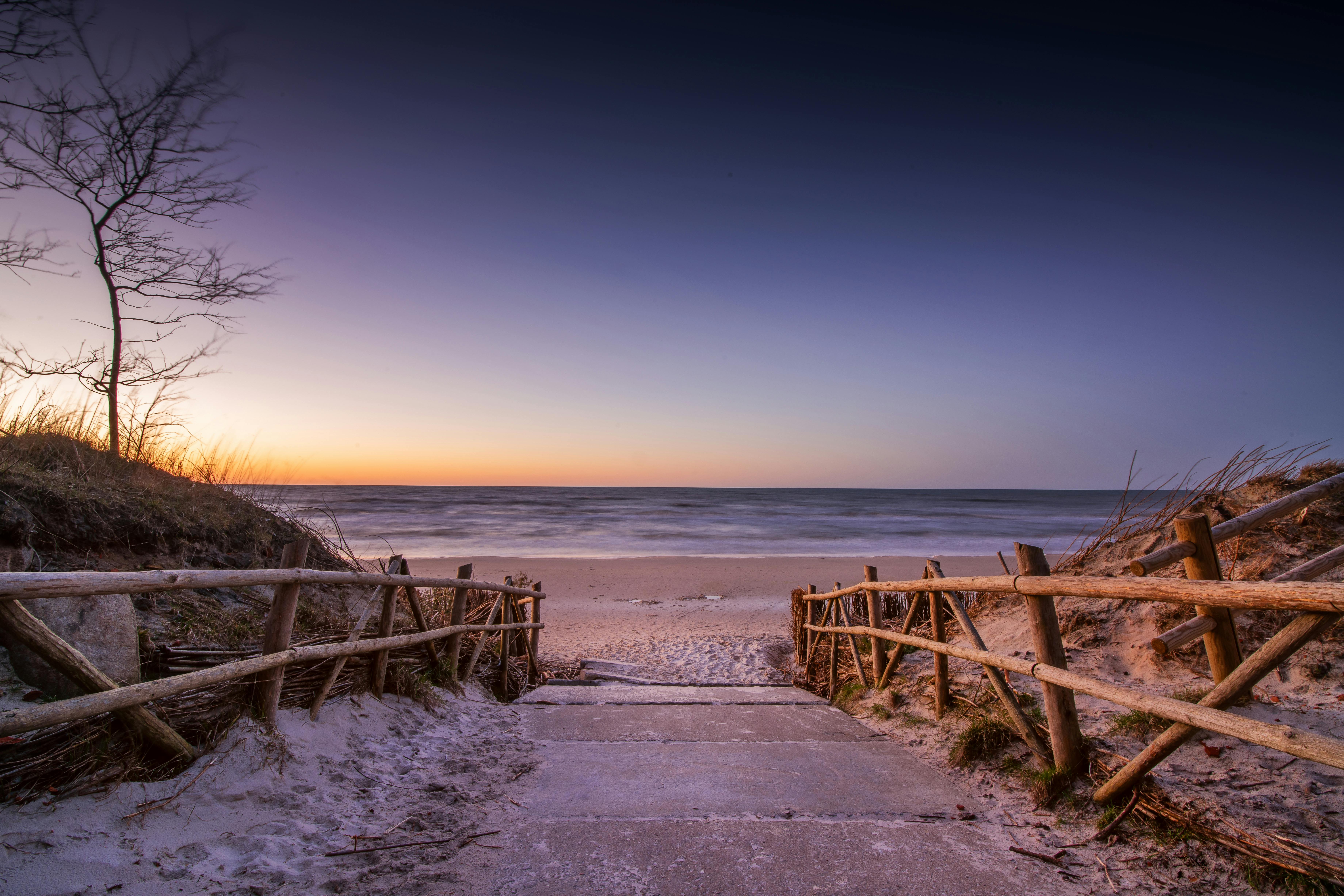 secluded beach path through sand dunes - beaches near me