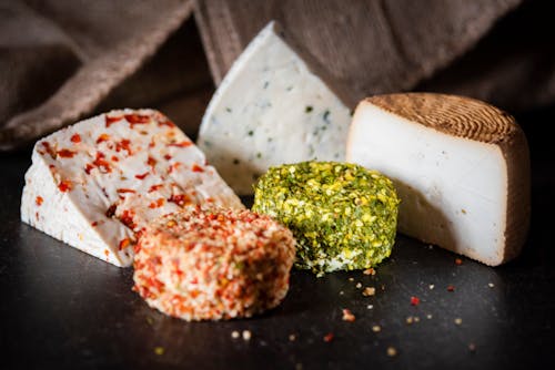 Various types of cheese placed on table