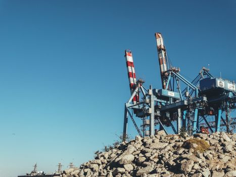 Port Container Crane on a Rocky Coast
