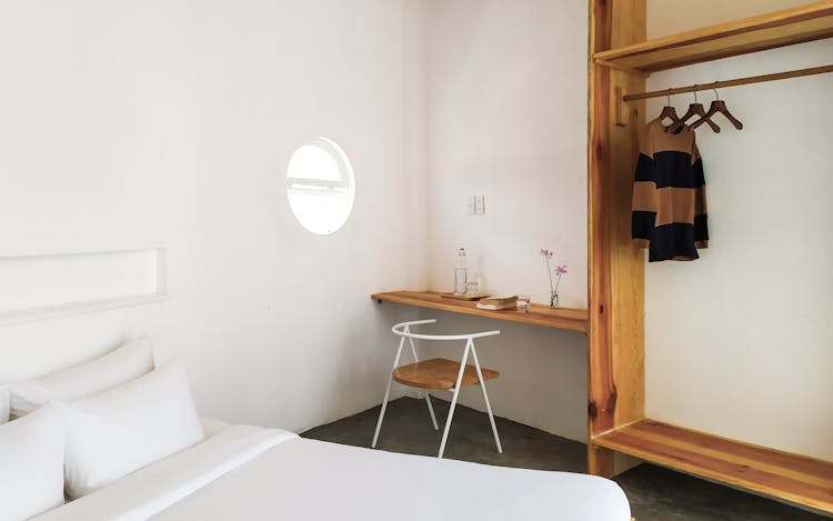 Hanging Jacket In A Wooden Cabinet In The BEdroom