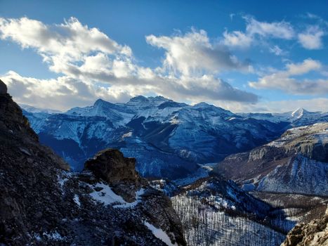 Breathtaking view of the snow-capped Rocky Mountains under a clear blue sky in Canada.