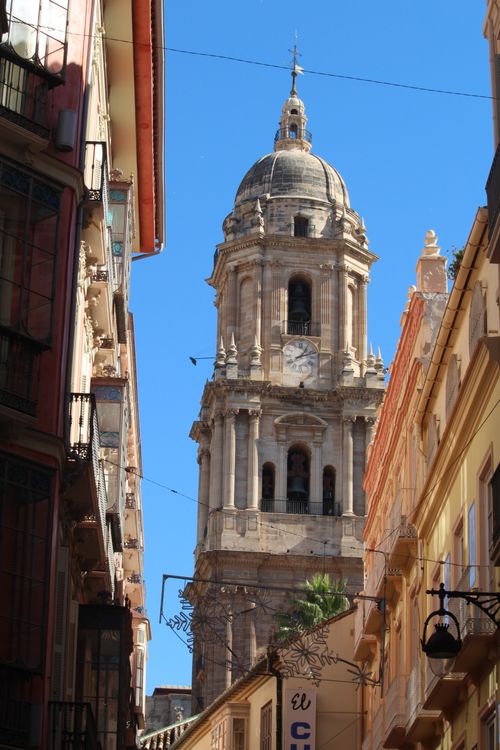 Free Stunning view of Cádiz cathedral tower set against a clear blue sky. Stock Photo