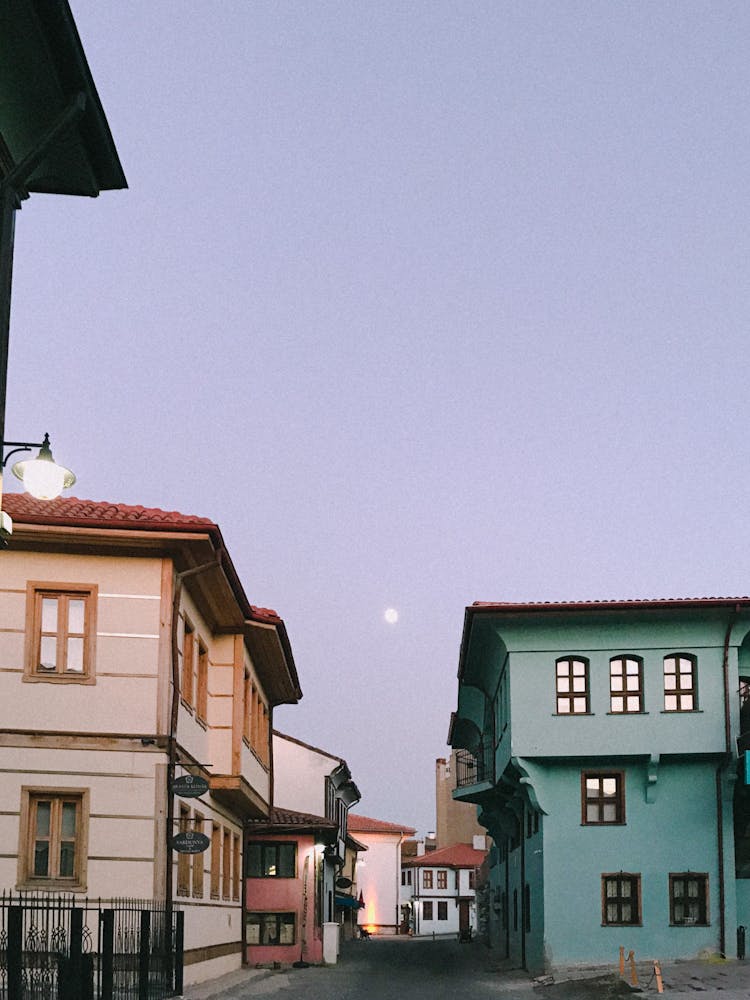 Beautiful Houses Of A Neighborhood Under Evening Sky