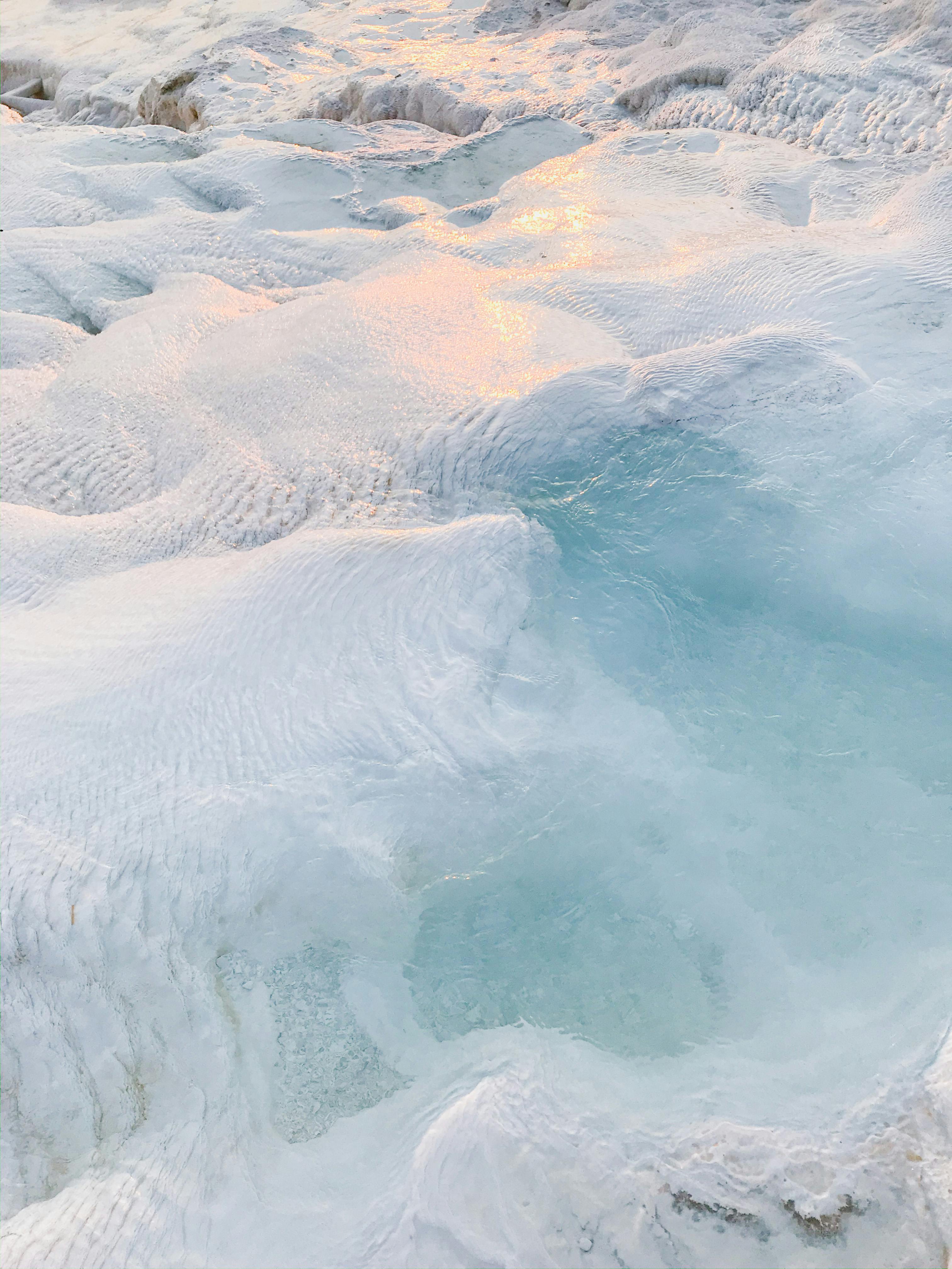 Free Majestic ice formations with reflective pools and glacier-like textures in the winter light. Stock Photo