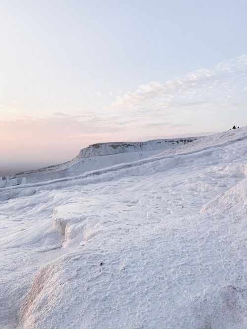 Free Scenic view of snow-covered slopes at Pamukkale during sunset, showcasing nature's beauty. Stock Photo