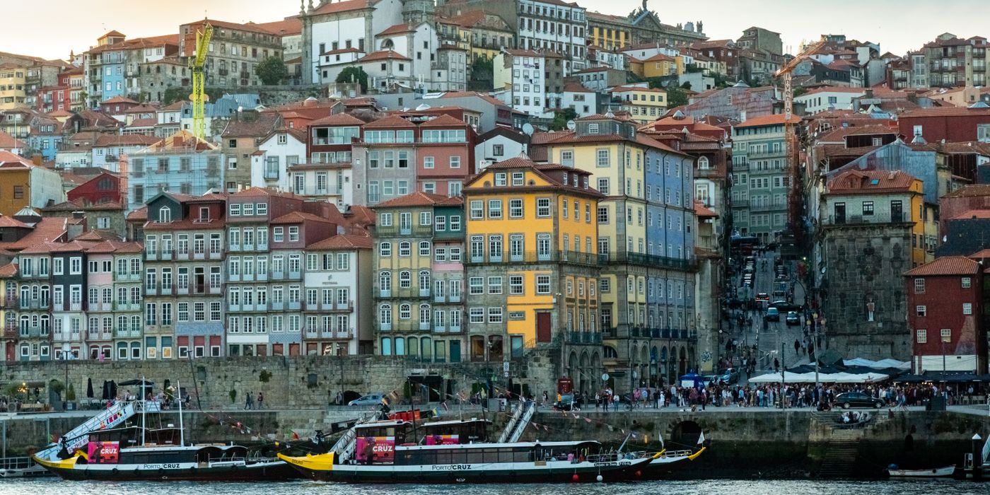 Historic riverside Porto with colorful buildings along the Douro at sunset