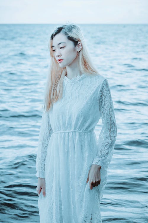 Elegant woman against sea water