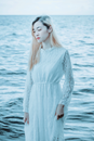 Elegant woman against sea water