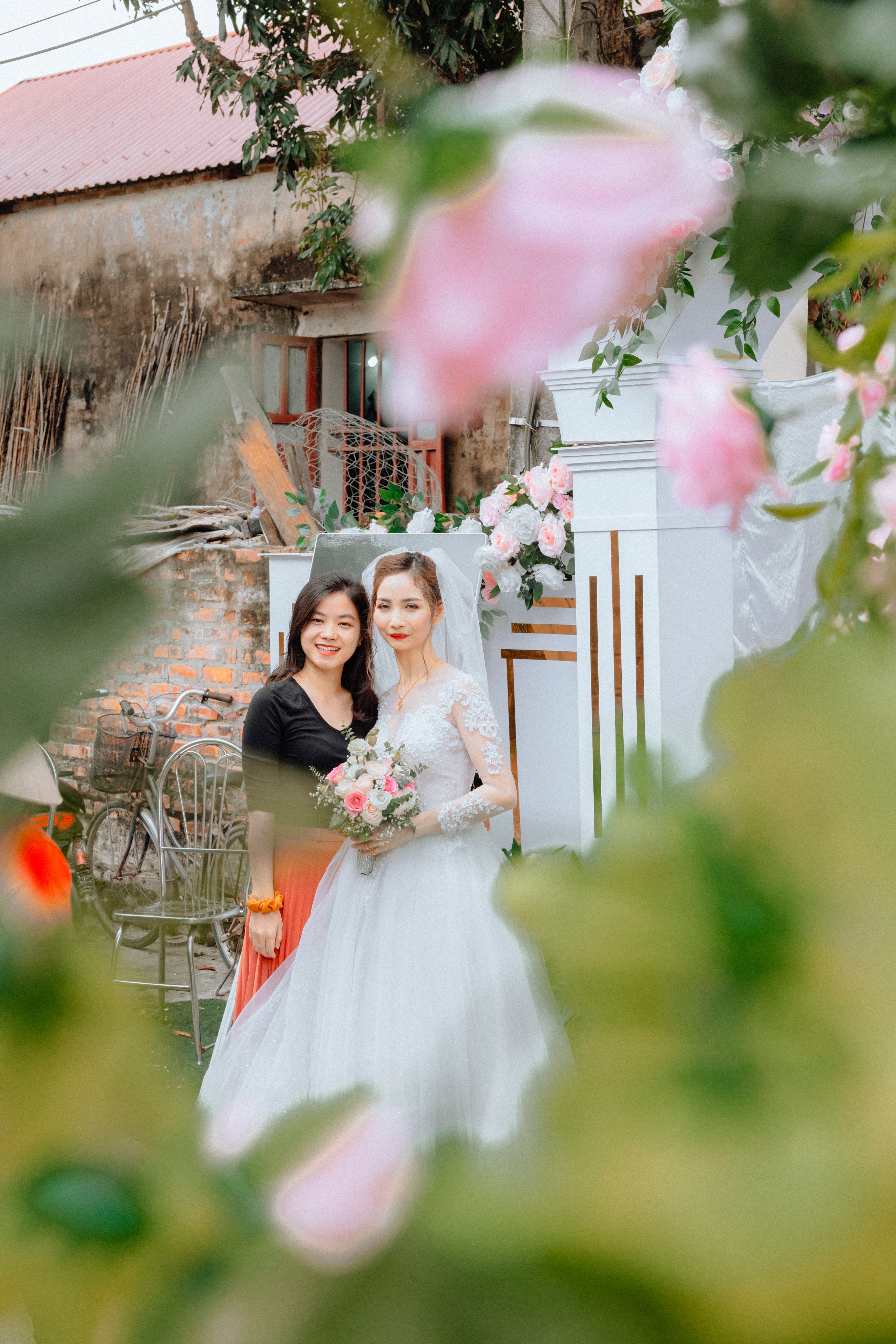Bride holding her bouquet outdoors among garden flowers