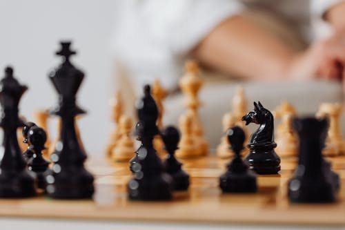 Free Close-Up Shot of Black Chess Pieces on Chessboard Stock Photo