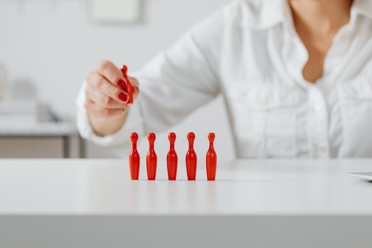 Person Holding A Tabletop Balling Pin