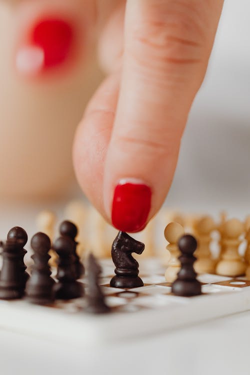Free Miniature Chess Pieces on a Chessboard Stock Photo