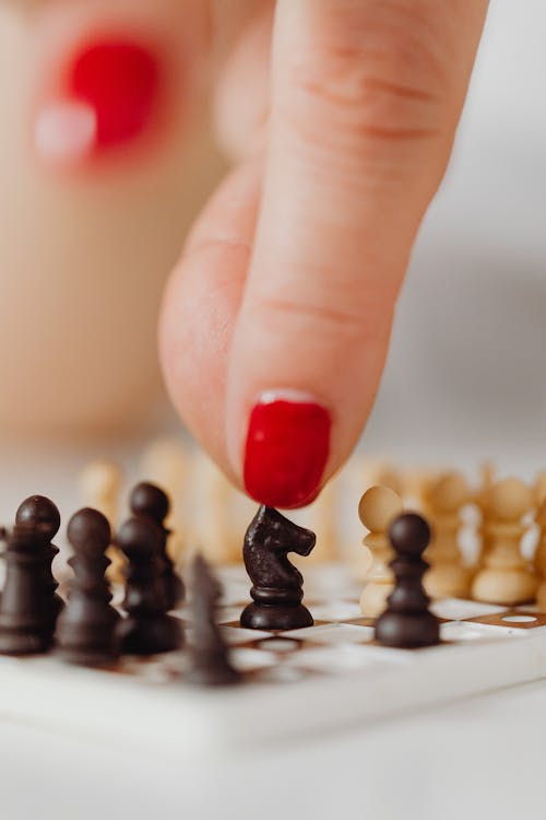 Miniature Chess Pieces on a Chessboard